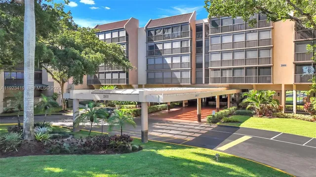 a view of a building with a yard