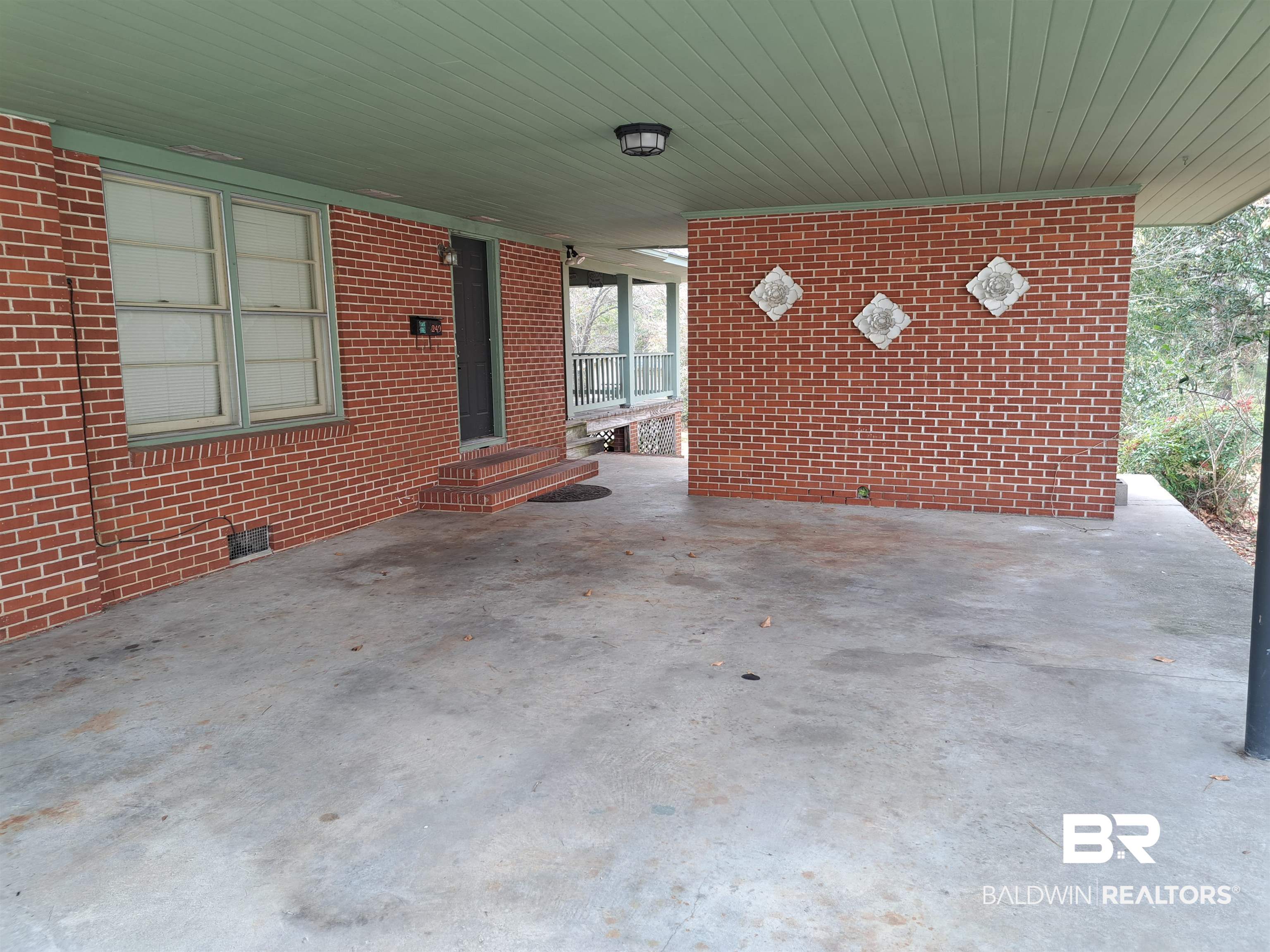 249 Newton Parkway Evergreen, AL 36401 - Photo 27 of 28 View of patio with a carport