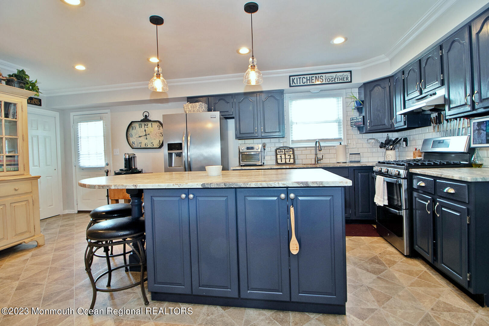 54 Davids Lane Howell, NJ 07731 - Photo 12 of 45 a kitchen with stainless steel appliances granite countertop wooden cabinets a sink a stove a dining table and chairs