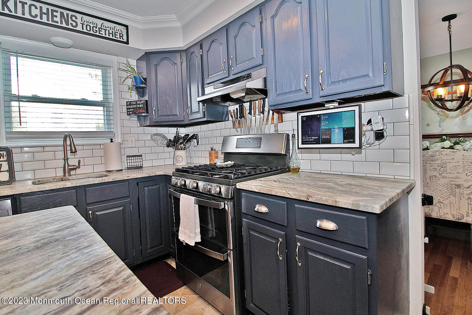 54 Davids Lane Howell, NJ 07731 - Photo 14 of 45 a kitchen with granite countertop wooden cabinets stove top oven and sink