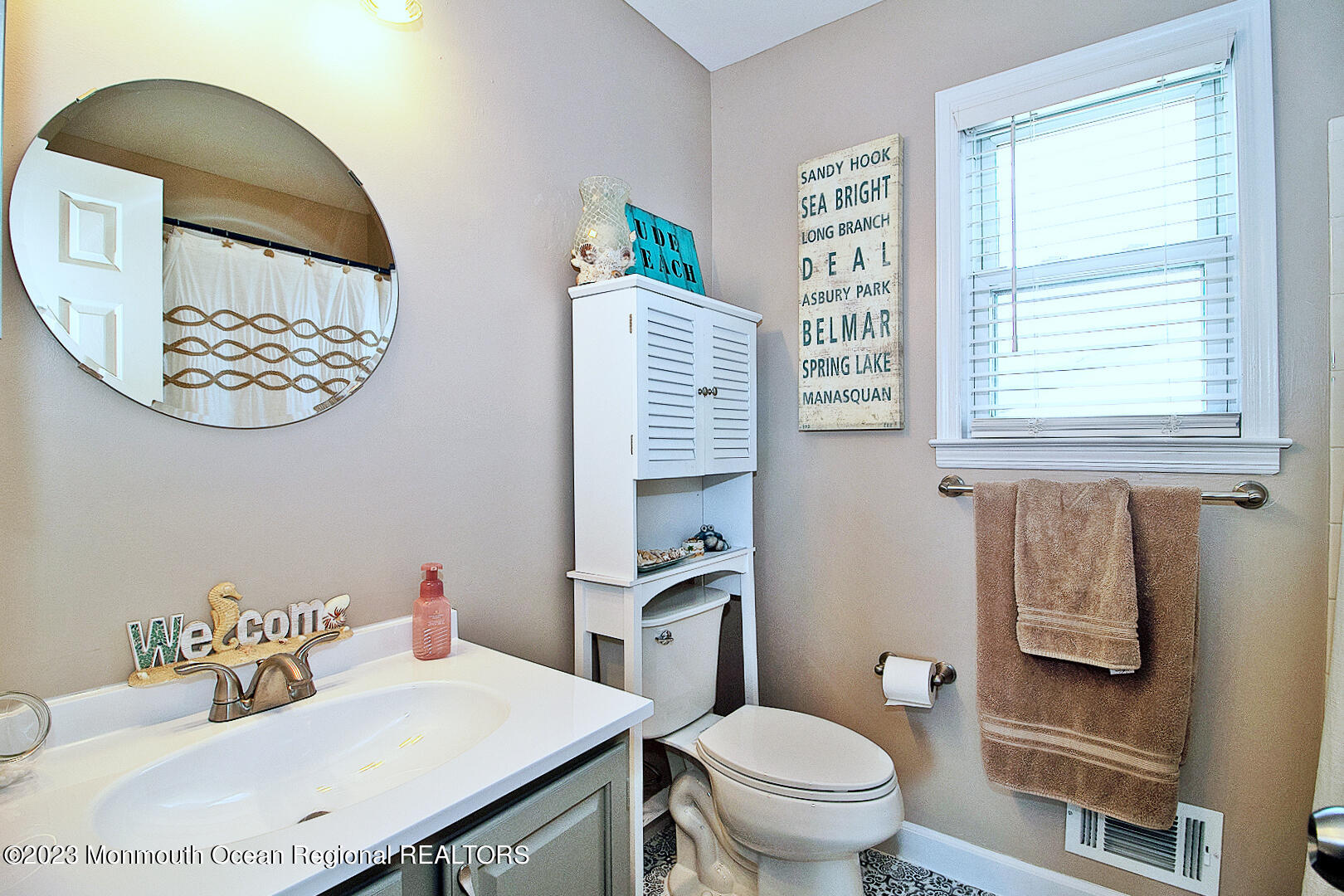 54 Davids Lane Howell, NJ 07731 - Photo 29 of 45 a bathroom with a sink a toilet and a window