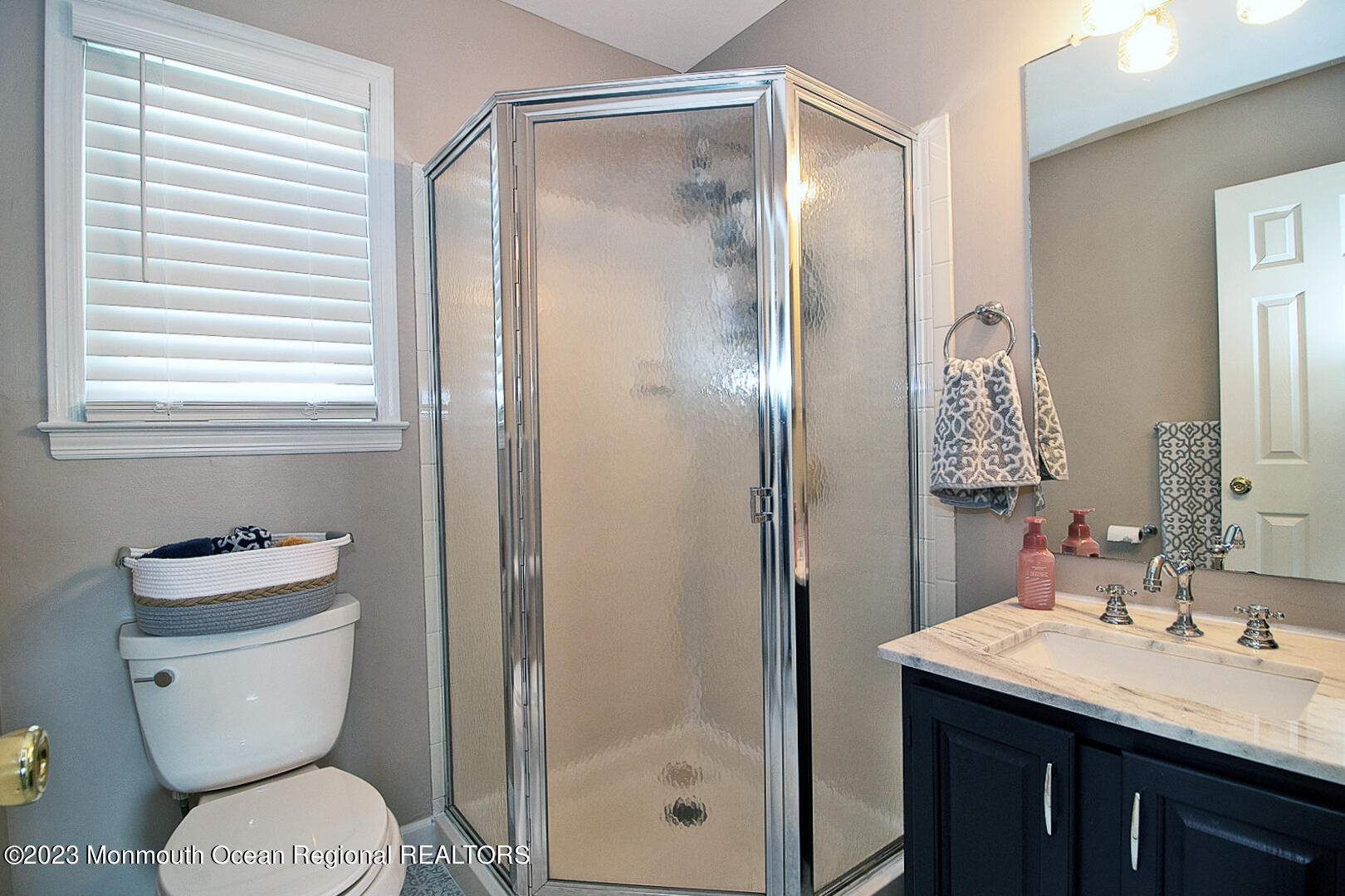54 Davids Lane Howell, NJ 07731 - Photo 33 of 45 a bathroom with a granite countertop toilet a sink and a mirror
