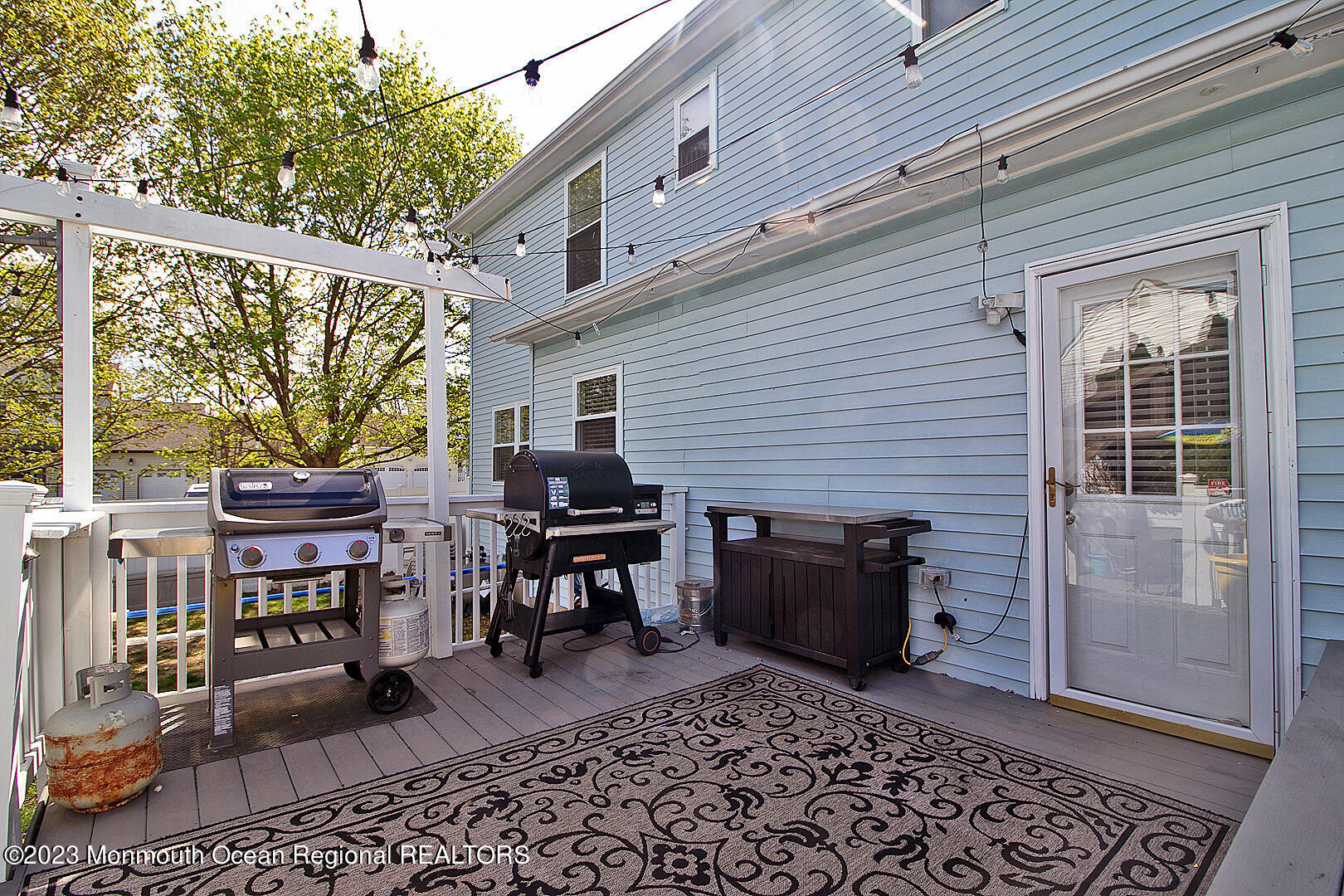 54 Davids Lane Howell, NJ 07731 - Photo 37 of 45 a backyard of a house with barbeque oven table and chairs