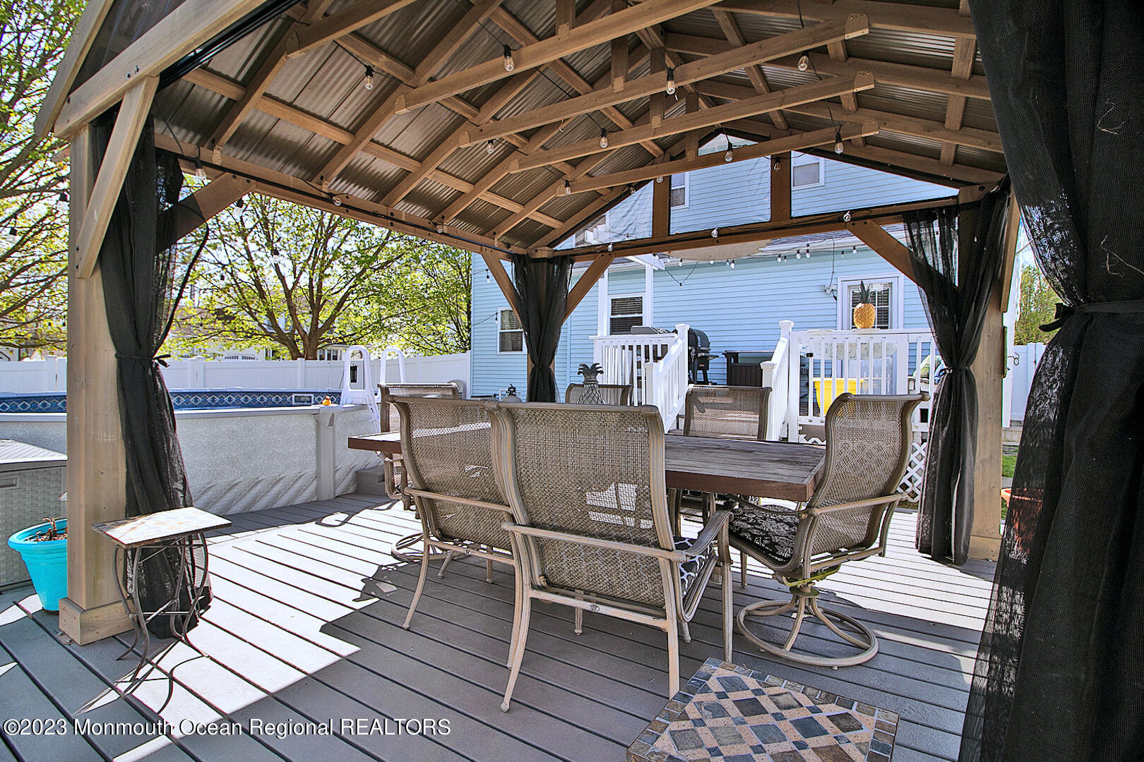 54 Davids Lane Howell, NJ 07731 - Photo 43 of 45 a view of a patio with a table and chairs