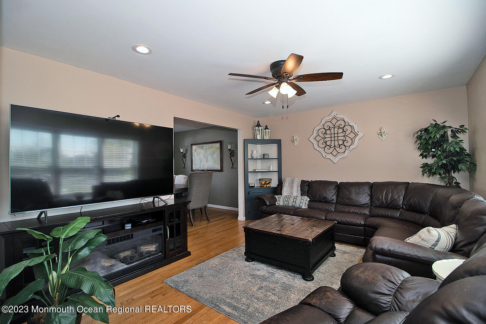 54 Davids Lane Howell, NJ 07731 - Photo 6 of 45 a living room with furniture a dining table and a potted plant