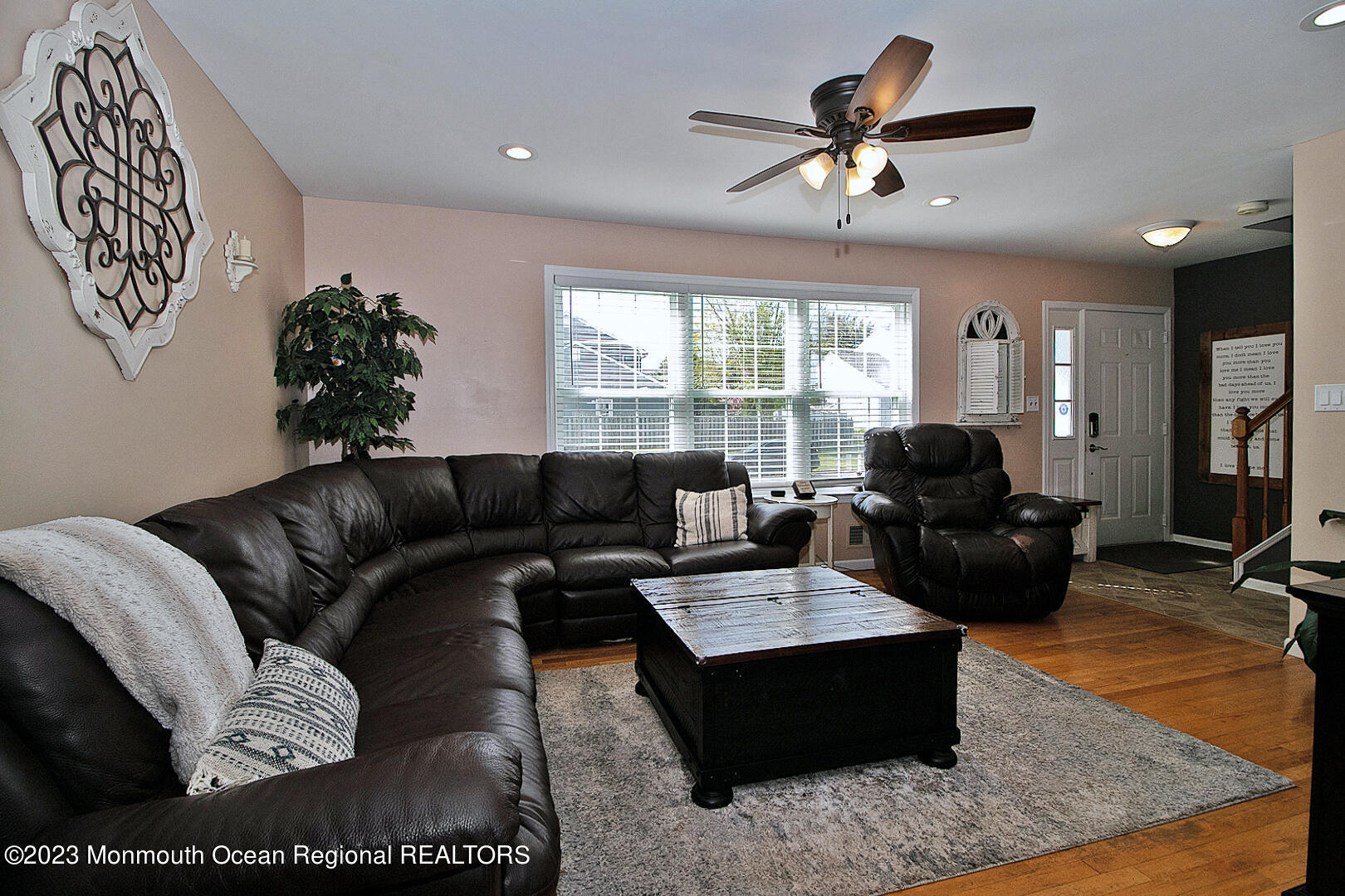 54 Davids Lane Howell, NJ 07731 - Photo 7 of 45 a living room with furniture ceiling fan and a rug