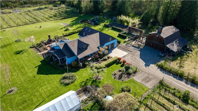 an aerial view of a house with a garden