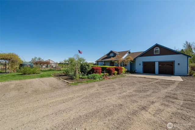 a view of backyard with swimming pool and outdoor seating