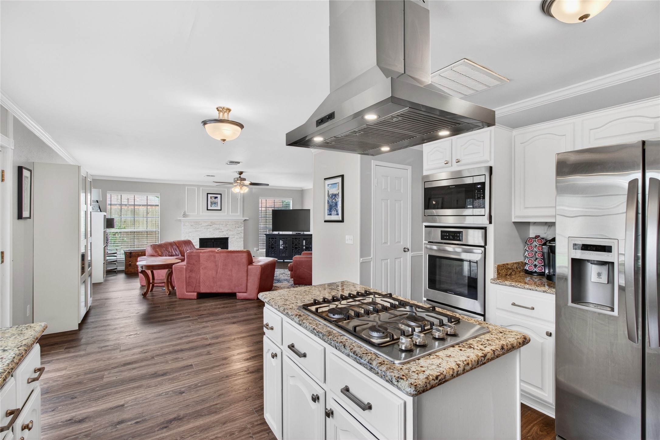 20214 Woodsboro Court Spring, TX 77388 - Photo 16 of 50 Breakfast Area connects to Family Room! Recently Updated Kitchen! Painted cabinets, Stainless Appliances & Vent Hood, Tile Backsplash! Recently Painted Interior! Luxury Vinyl Plank throughout 1st Floor!
