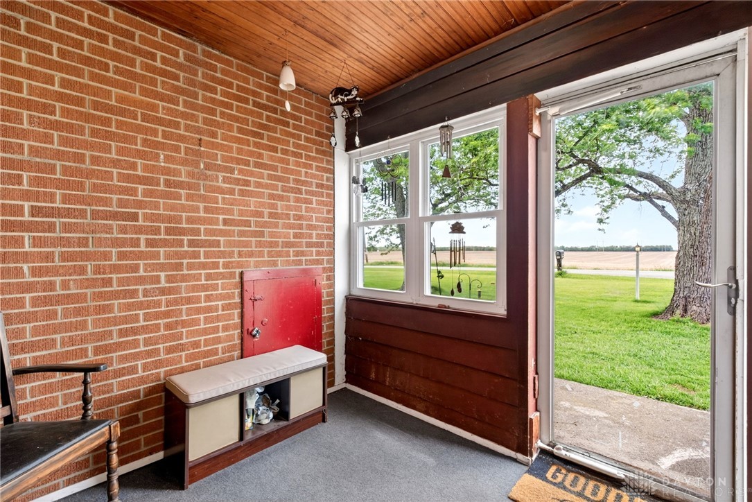 2470 Clark Run Road Xenia, OH 45385 - Photo 22 of 57 This porch offers a welcoming entry with expansive views of the surrounding natural landscape.
