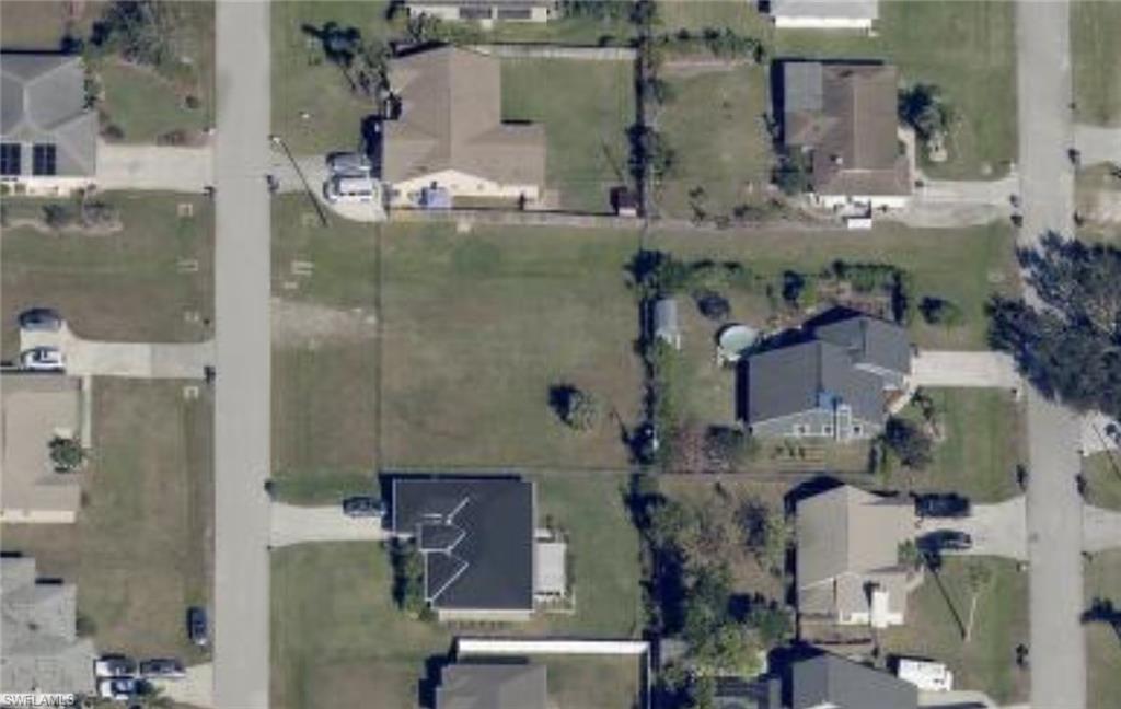 17525 Homewood Road Fort Myers, FL 33967 - Photo 1 of 15 an aerial view of residential houses with outdoor space