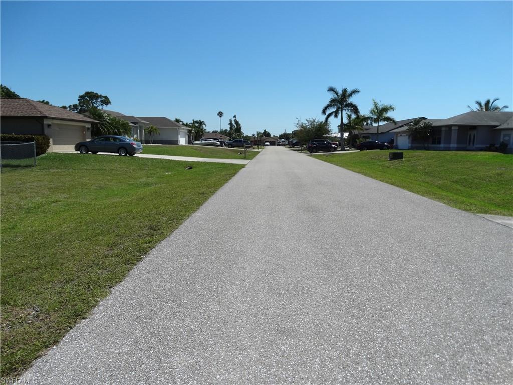 17525 Homewood Road Fort Myers, FL 33967 - Photo 8 of 15 a view of a field of grass and trees