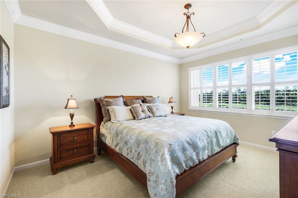 9513 Ironstone Terrace, Unit 202 Naples, FL 34120 - Photo 19 of 47 a bedroom with bed and window
