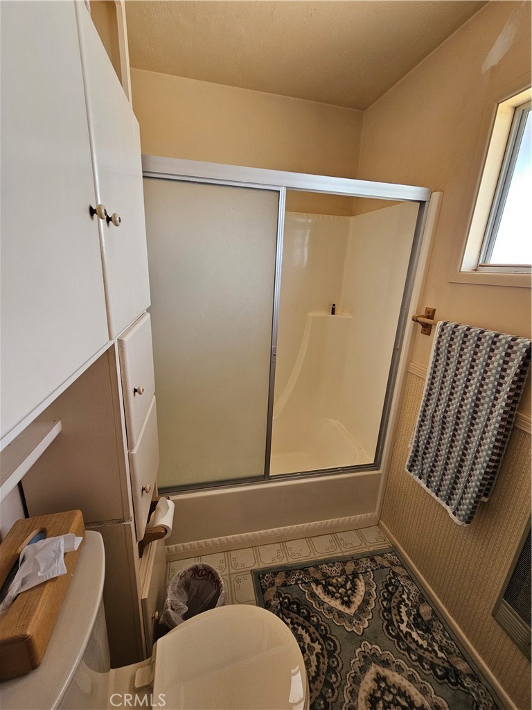 5566 Oleta Road Johnson Valley, CA 92285 - Photo 18 of 48 a bathroom with a window and a shower