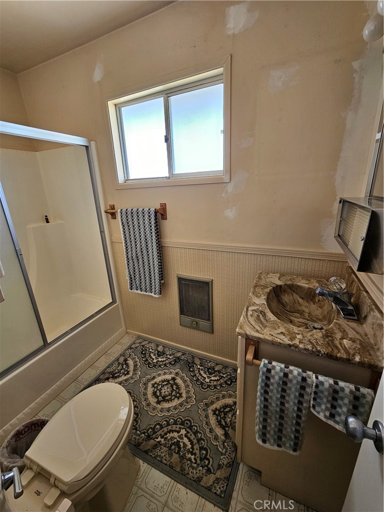 5566 Oleta Road Johnson Valley, CA 92285 - Photo 19 of 48 a bathroom with a toilet a sink and a mirror