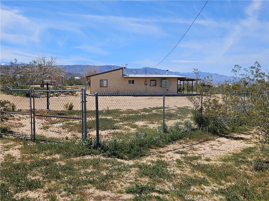 5566 Oleta Road Johnson Valley, CA 92285 - Photo 34 of 48 a view of a house with a yard
