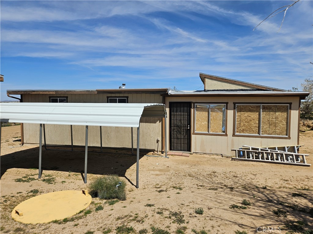 5566 Oleta Road Johnson Valley, CA 92285 - Photo 36 of 48 a view of a house with a wooden fence