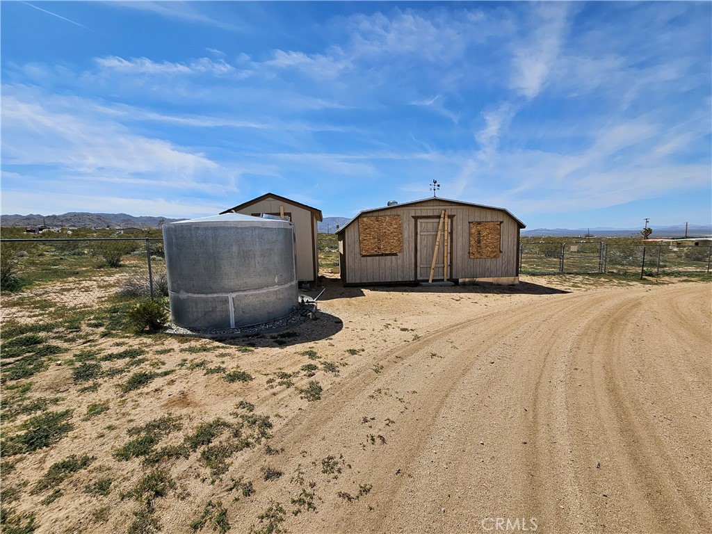 5566 Oleta Road Johnson Valley, CA 92285 - Photo 39 of 48 a view of a house with a snow in the yard