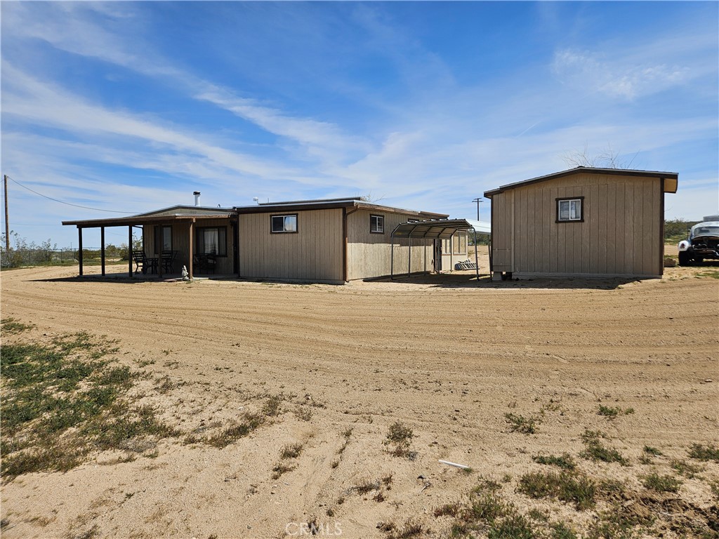 5566 Oleta Road Johnson Valley, CA 92285 - Photo 5 of 48 a large house with a large parking space