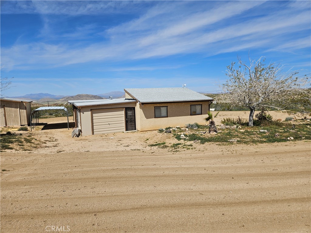 5566 Oleta Road Johnson Valley, CA 92285 - Photo 7 of 48 a front view of a house with a yard