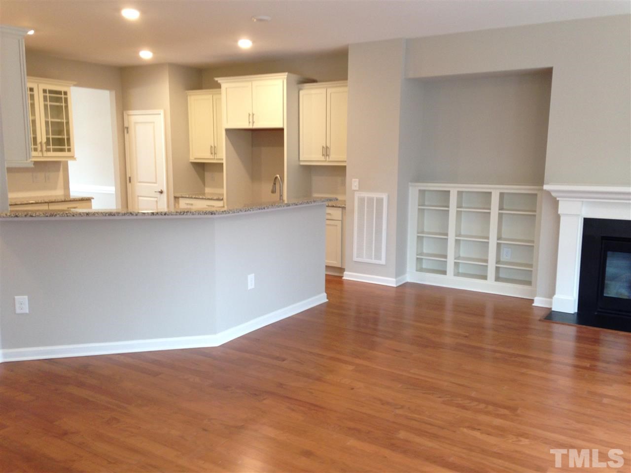 702 Edgewater Ridge Court Apex, NC 27523 - Photo 6 of 21 Kitchen open to family room.