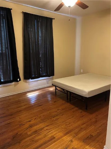 a bed room with a bed and a mirror