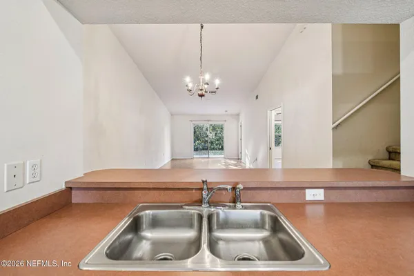 a kitchen with a sink and a window