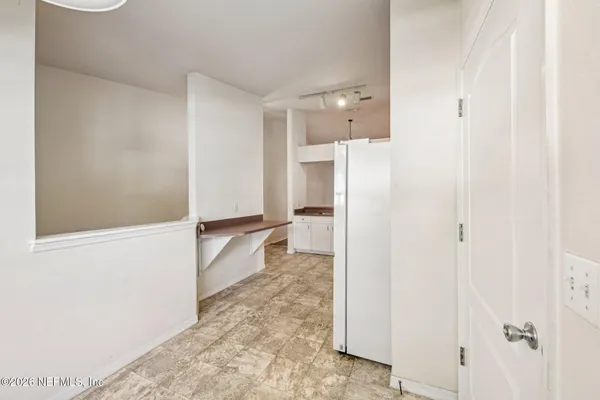 a bathroom with a bathtub and a walk in closet