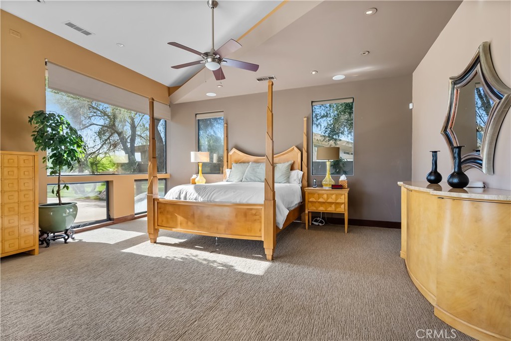 68 Royal St Georges Way Rancho Mirage, CA 92270 - Photo 45 of 75 a bedroom with furniture and a flat screen tv