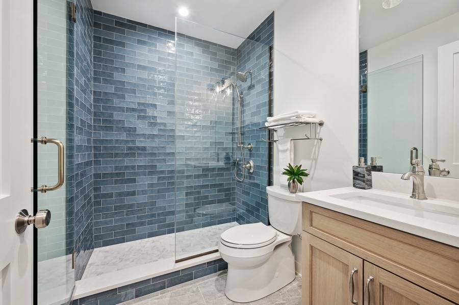 2004 West Addison Street, Unit 1E Chicago, IL 60618 - Photo 21 of 27 a bathroom with a sink a toilet and shower
