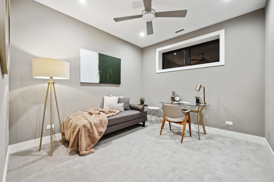 2004 West Addison Street, Unit 1E Chicago, IL 60618 - Photo 23 of 27 a bedroom with a bed and a chair