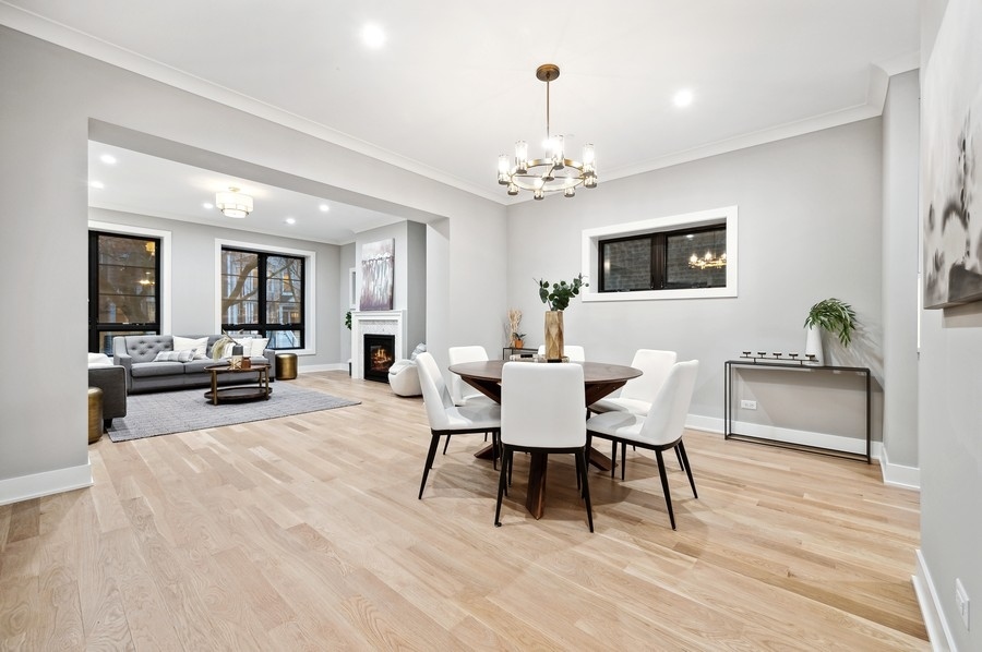 2004 West Addison Street, Unit 1E Chicago, IL 60618 - Photo 5 of 27 a view of a dining room with furniture and wooden floor