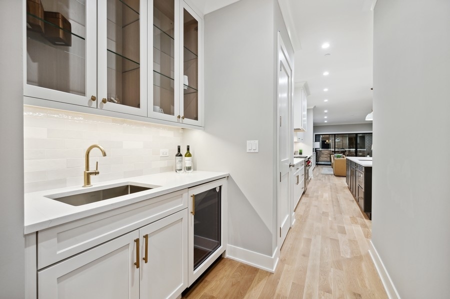 2004 West Addison Street, Unit 1E Chicago, IL 60618 - Photo 6 of 27 a view of a kitchen with a sink and cabinets