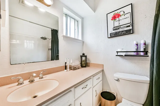 a utility room with cabinets washer and dryer