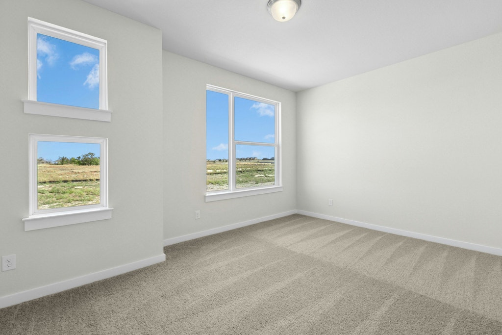 4733 Pleasant Place Round Rock, TX 78665 - Photo 19 of 33 an empty room with windows