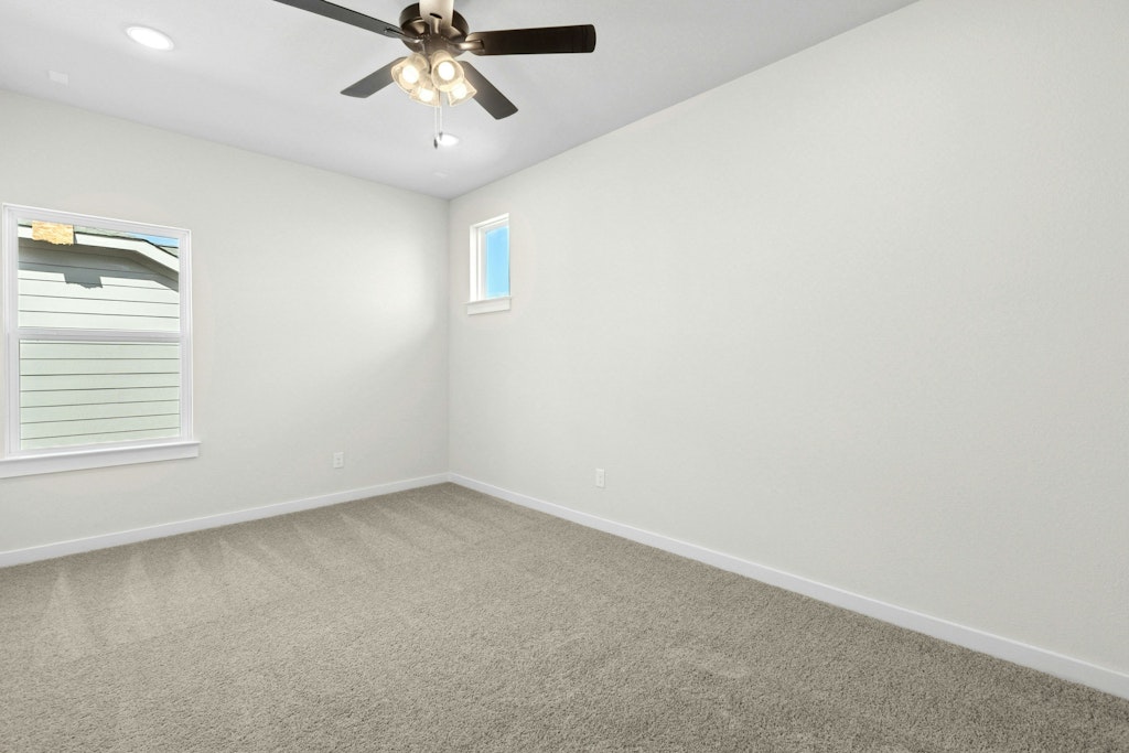4733 Pleasant Place Round Rock, TX 78665 - Photo 24 of 33 an empty room with a window and a fan