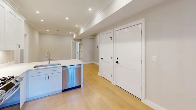 a large bathroom with a large tub and shower