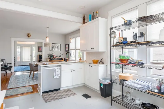 a kitchen with stainless steel appliances kitchen island granite countertop a sink and cabinets