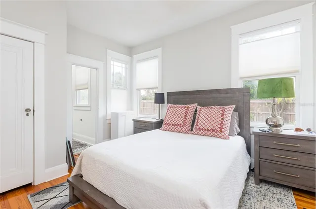 a bedroom with a bed and a window