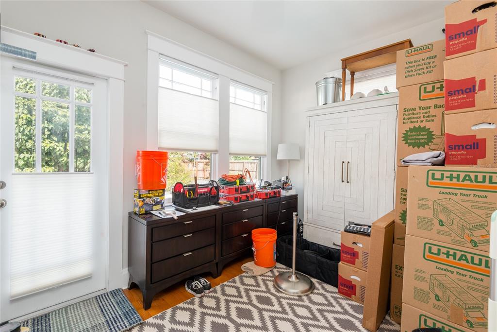 705 West Alfred Street Tampa, FL 33603 - Photo 15 of 25 a room with furniture a flat screen tv and a window