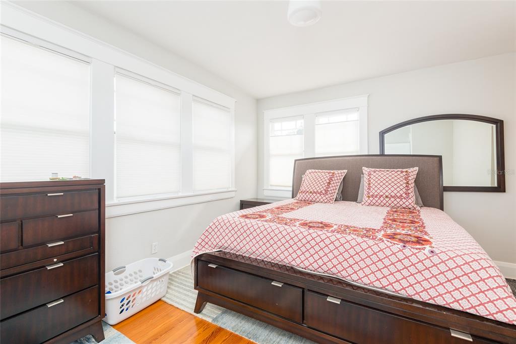 705 West Alfred Street Tampa, FL 33603 - Photo 16 of 25 a bedroom with a bed and a mirror