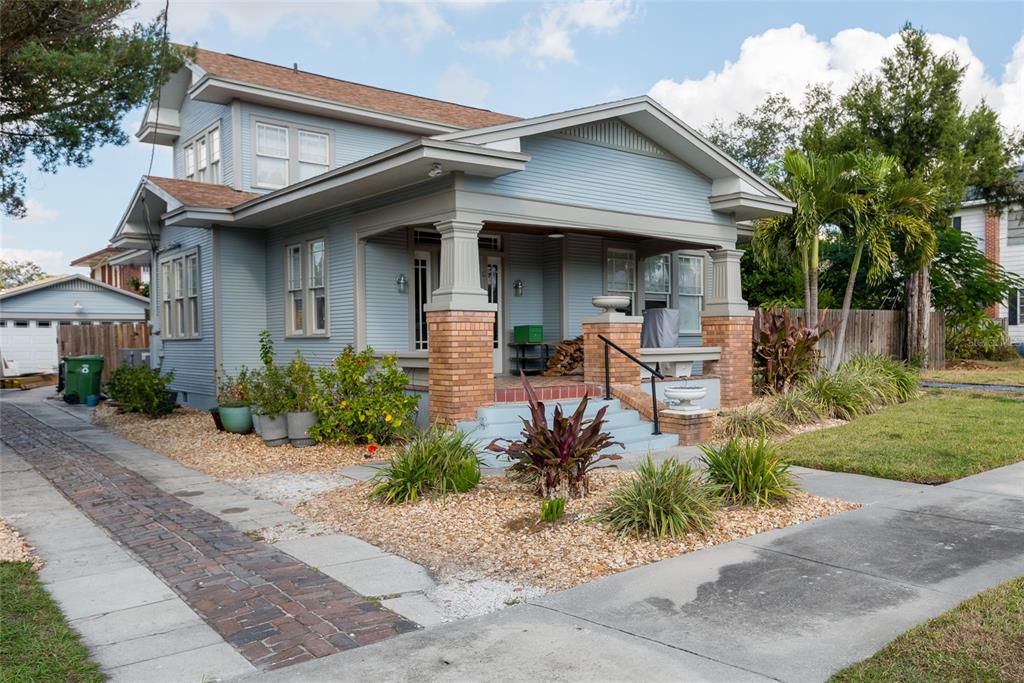 705 West Alfred Street Tampa, FL 33603 - Photo 2 of 25 a front view of a house with a yard