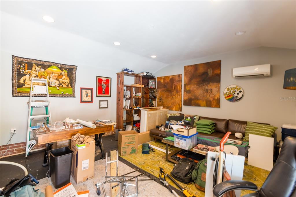 705 West Alfred Street Tampa, FL 33603 - Photo 21 of 25 a room with furniture and a flat screen tv