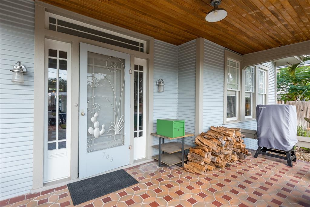 705 West Alfred Street Tampa, FL 33603 - Photo 3 of 25 a view of a porch with furniture and front door