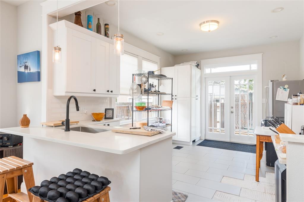 705 West Alfred Street Tampa, FL 33603 - Photo 10 of 25 a kitchen with a sink appliances and cabinets