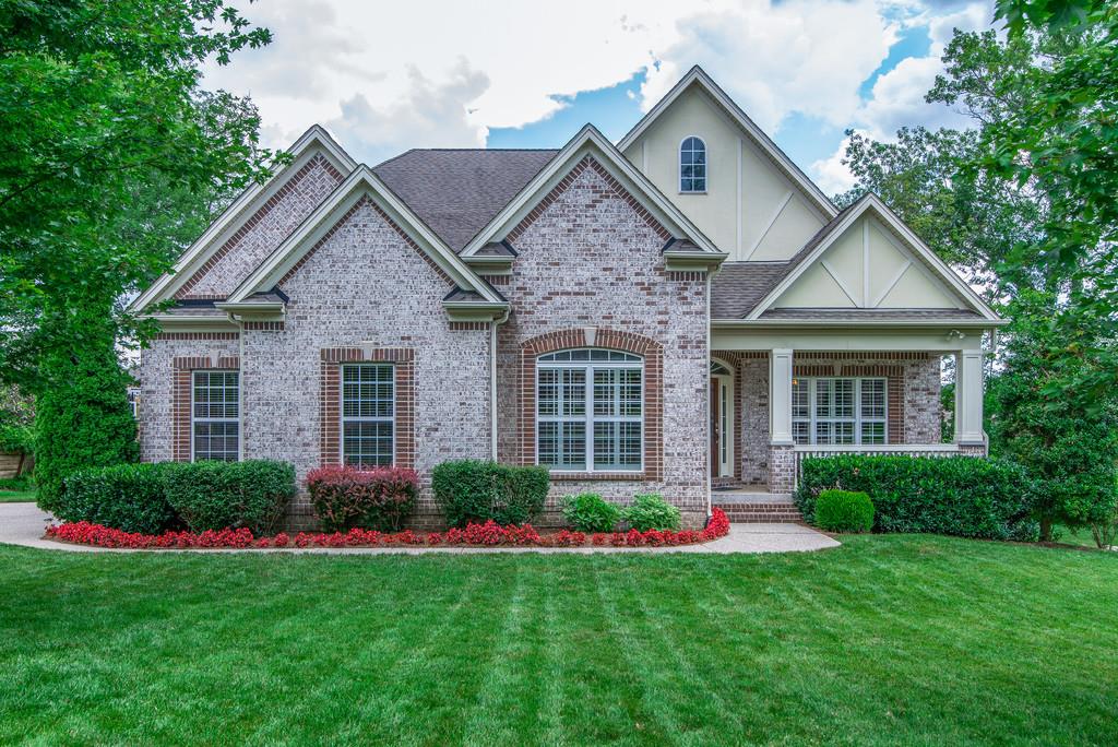1219 White Rock Road Spring Hill, TN 37174 - Photo 1 of 30 a front view of a house with garden