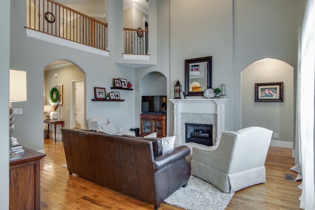 1219 White Rock Road Spring Hill, TN 37174 - Photo 14 of 30 a living room with furniture and a fireplace