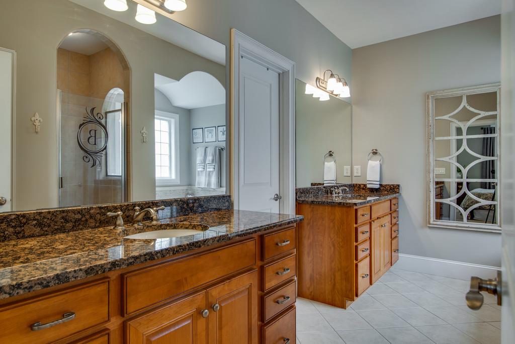 1219 White Rock Road Spring Hill, TN 37174 - Photo 16 of 30 a bathroom with a granite countertop sink and a mirror