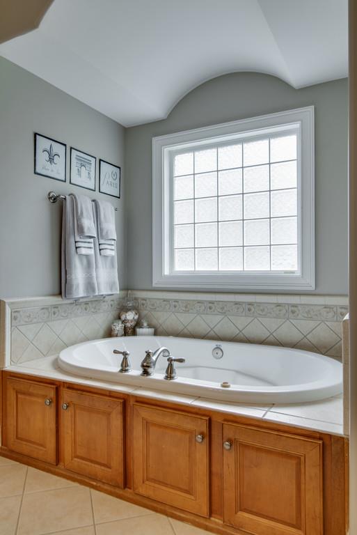 1219 White Rock Road Spring Hill, TN 37174 - Photo 17 of 30 a bathroom with a sink and a mirror