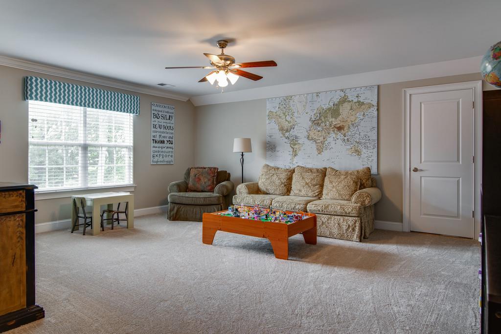 1219 White Rock Road Spring Hill, TN 37174 - Photo 19 of 30 a living room with furniture and a large window